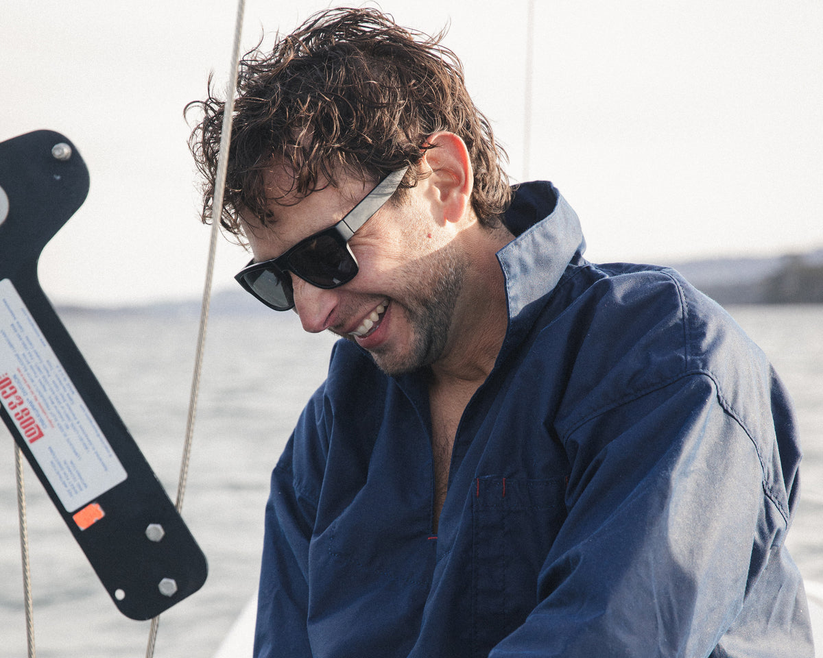 Sitting on deck in the Mariner's Smock, navy Australian oilskin